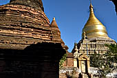 Bagan Myanmar. Next to the Gubyaukgyi stands the gilded Myazedi or 'Emerald Stupa'. 